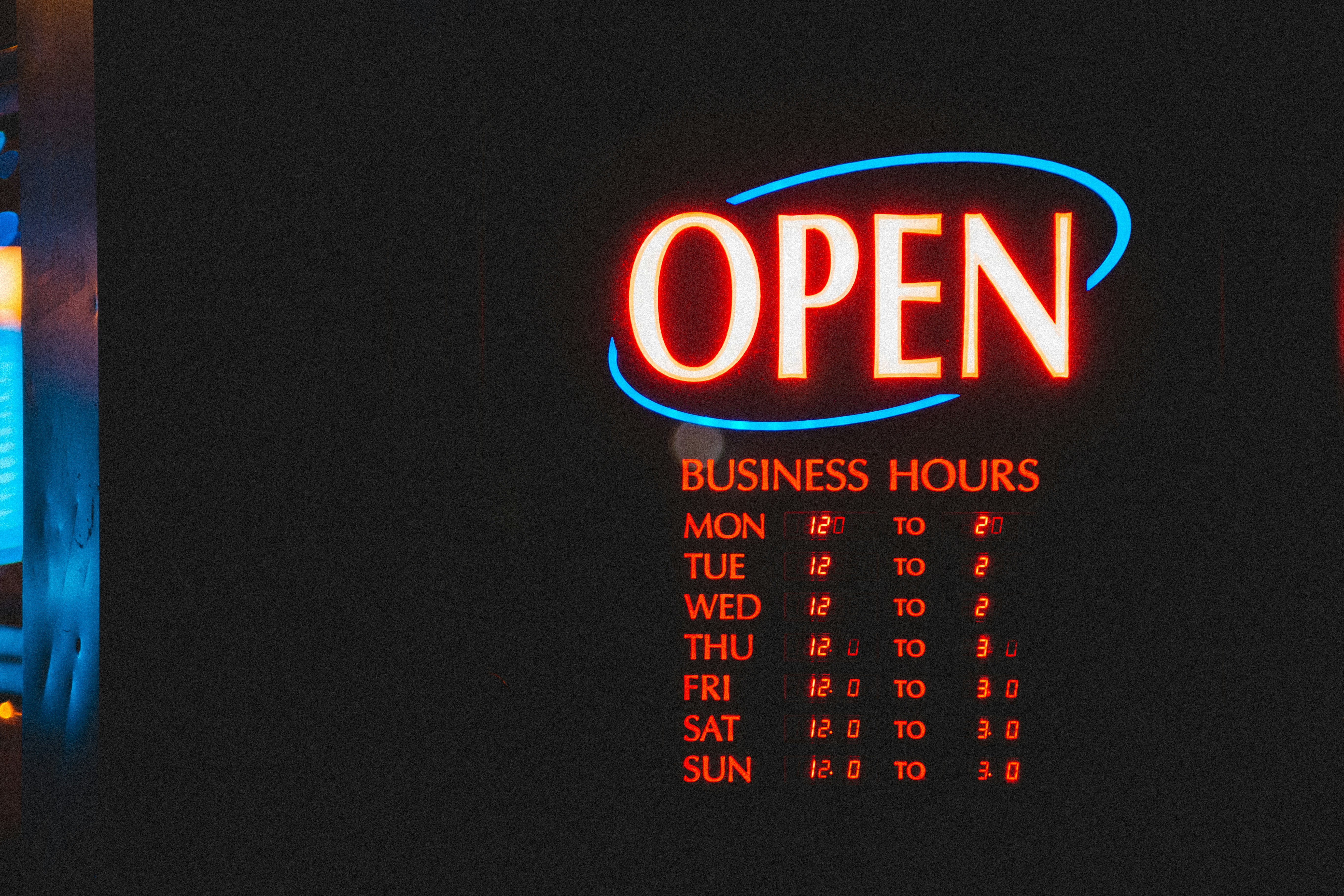 Open business hours sign displaying operational times for each day of the week, emphasizing customer accessibility for Google Business Profile optimization.